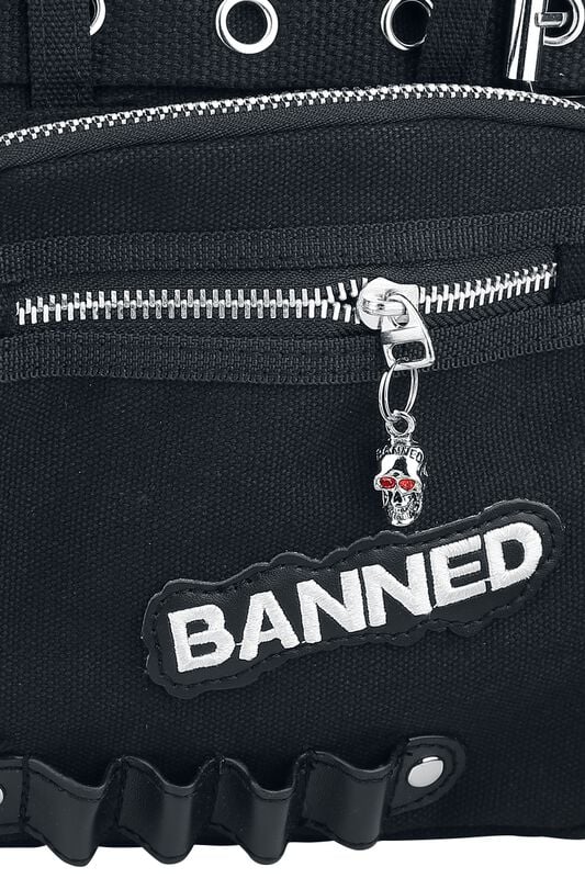 Black bag with 'BANNED' patch and skull charm on zipper